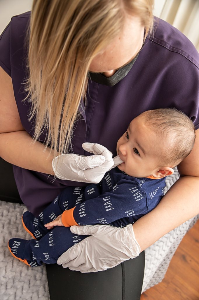 Infant receives craniosacral therapy